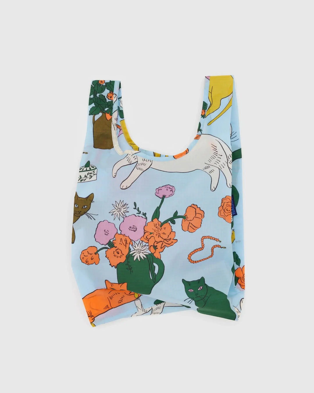 Baby Baggu reusable shopping bag with colorful table cats pattern, made from recycled ripstop nylon. Folds into 4" × 4" pouch.