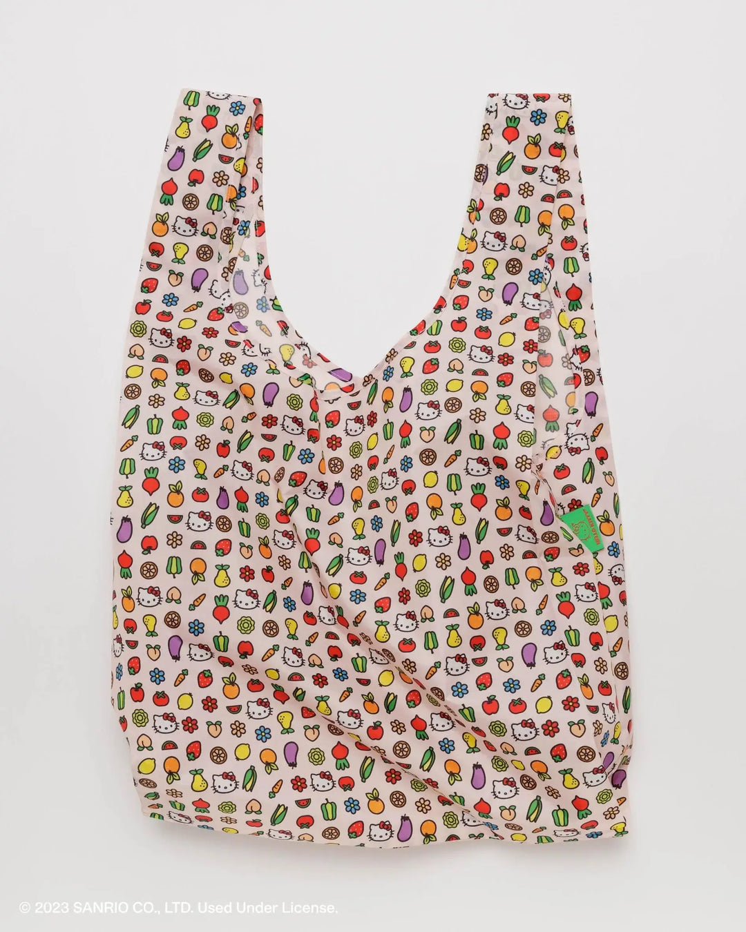 Standard Baggu reusable bag with Hello Kitty icons, colorful print on recycled polyester, holds up to 50lbs, eco-friendly design.