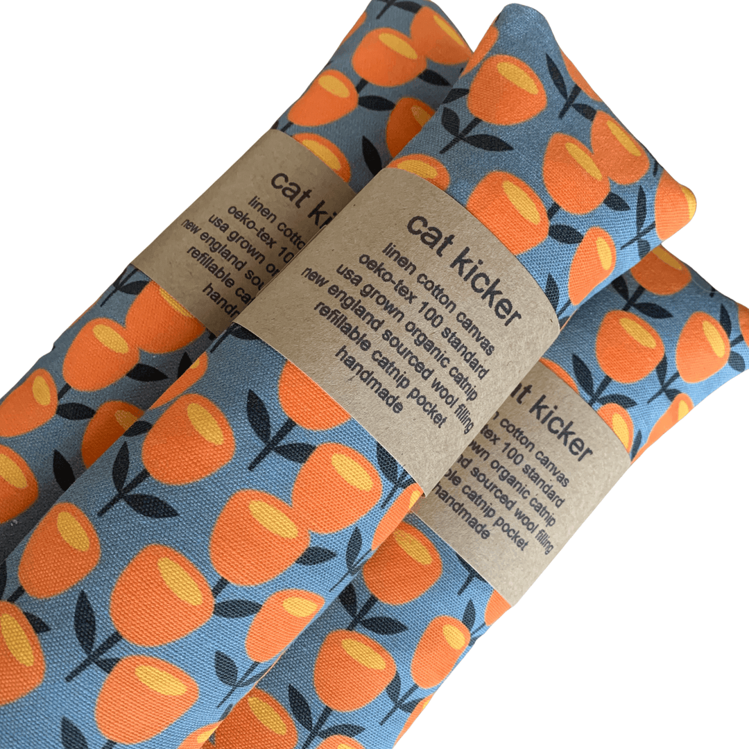 Organic cat kicker toys made of durable linen cotton canvas, filled with USA-grown catnip, featuring vibrant orange floral design.
