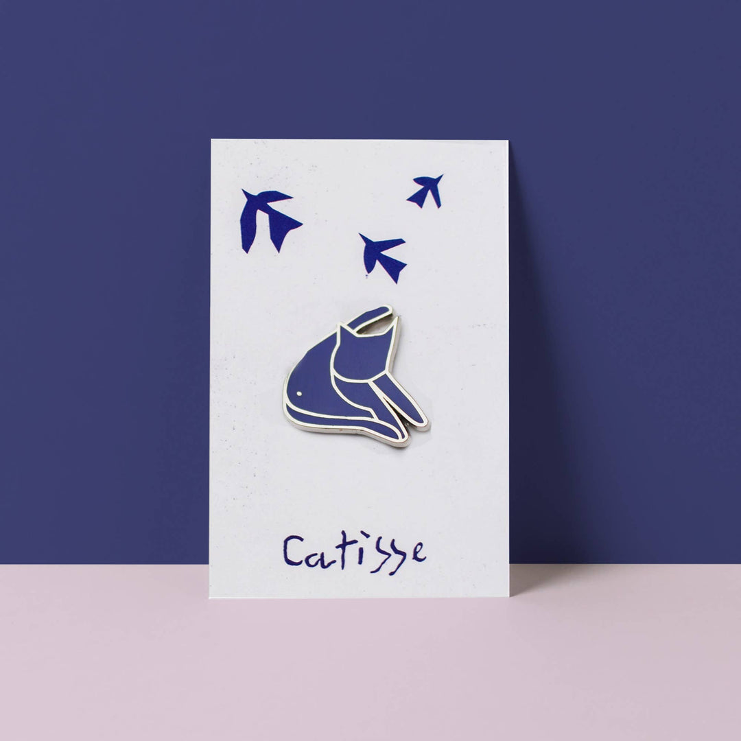 Catisse Blue Cat enamel pin featuring a stylized cat design against a minimalist background.