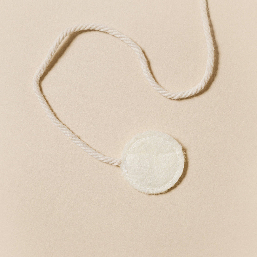Birdie Cat Toy with a soft pom-pom on a string making it perfect for playful cat chases and interactive play.