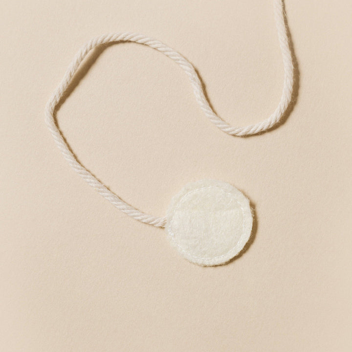 Birdie Cat Toy with a soft pom-pom on a string making it perfect for playful cat chases and interactive play.