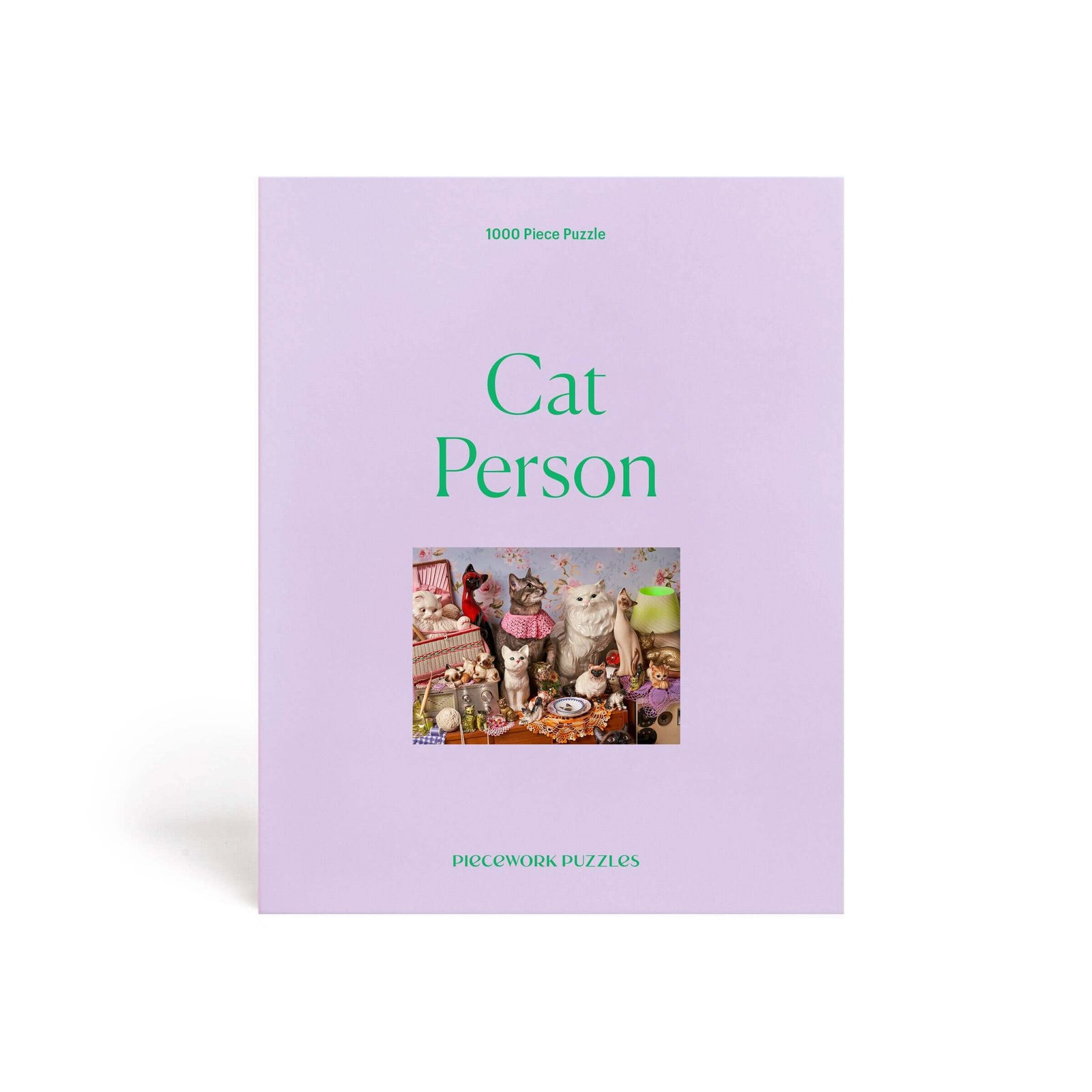 Cat Person 1000 piece puzzle box featuring playful cat illustrations and colorful tchotchkes.