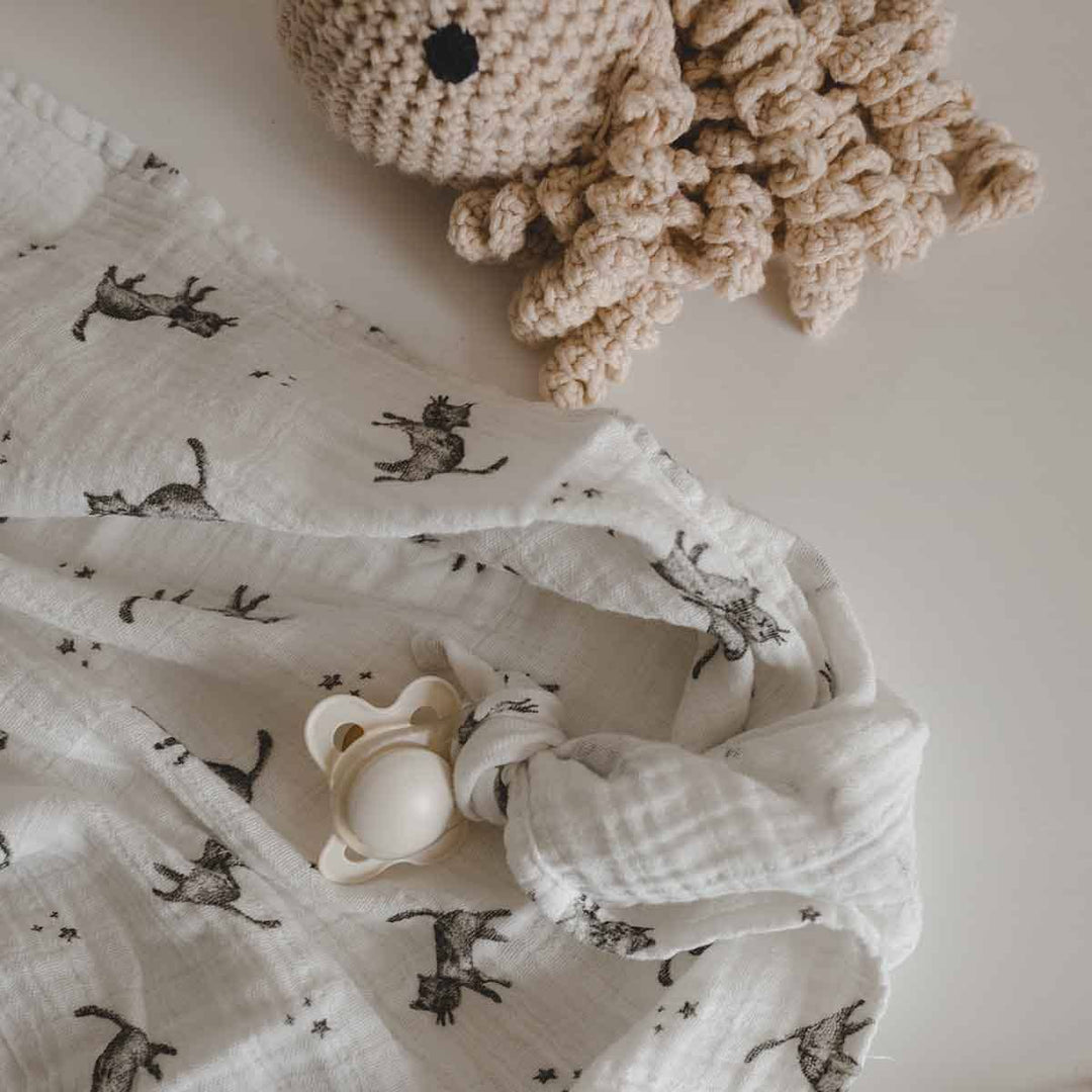 Bianca swaddle in ecru with cat print, 100% cotton muslin. Perfect for baby blanket, swaddle, or burp cloth.