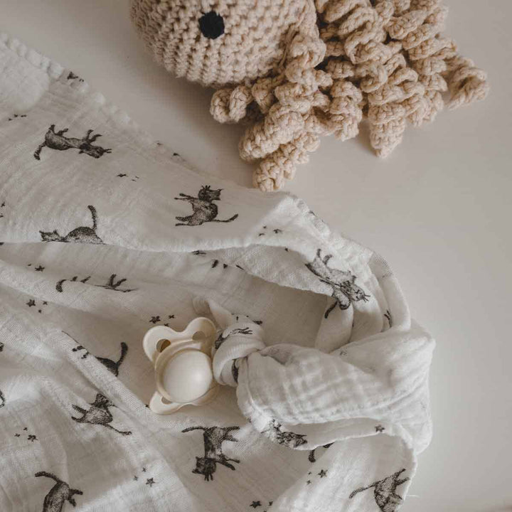 Bianca swaddle in ecru with cat print, 100% cotton muslin. Perfect for baby blanket, swaddle, or burp cloth.