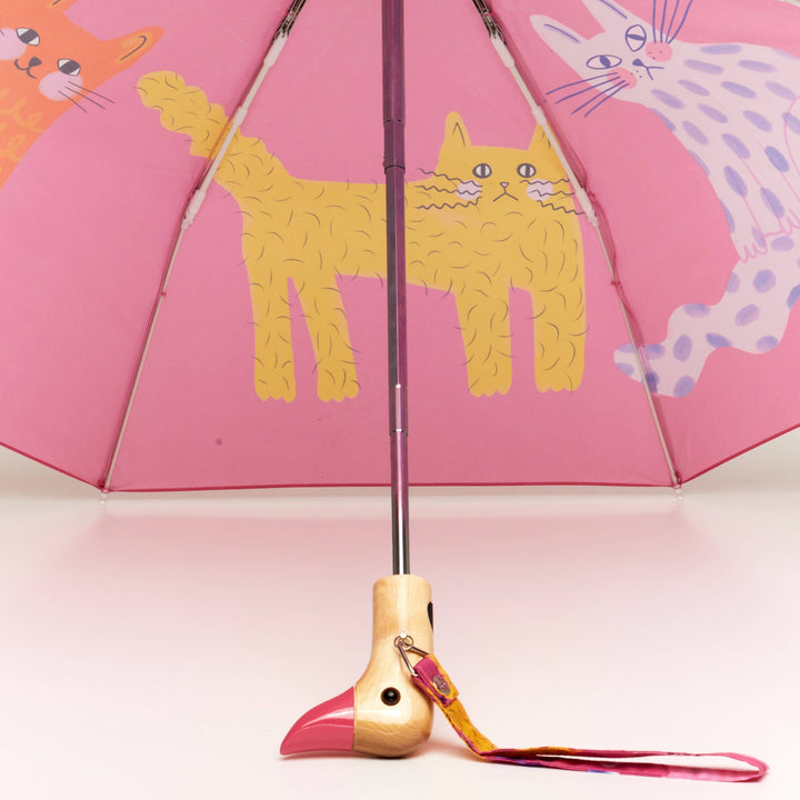 Duck Umbrella - Fuchsia Arty Cats with playful cat designs and a unique duck-shaped handle