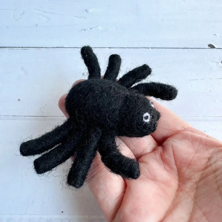 Handmade felted black spider toy for Halloween in person's hand - Halloween bundle cat toy.