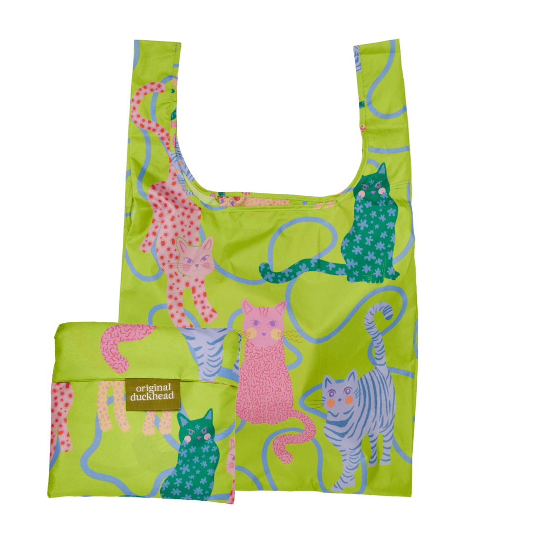 Lime Arty Cats eco-friendly reusable bag, showcasing playful cat designs and compact storage for sustainable living.