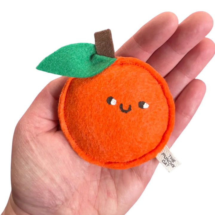 Handmade catnip orange toy with cute smiley face, crafted from wool felt and filled with organic catnip.