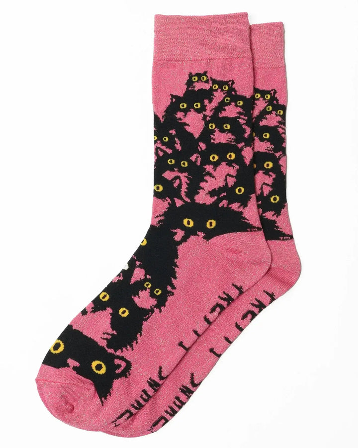 Pink glitter kitty socks featuring playful black cats with yellow eyes, perfect for cat lovers and cozy comfort.