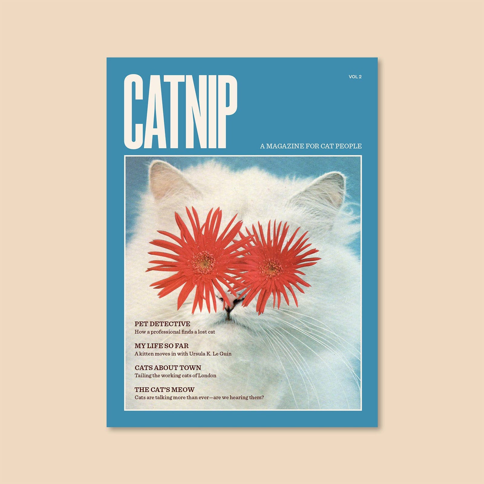 Catnip Magazine: Volume 2 cover featuring a cat with flower eyes, celebrating feline culture and stories.