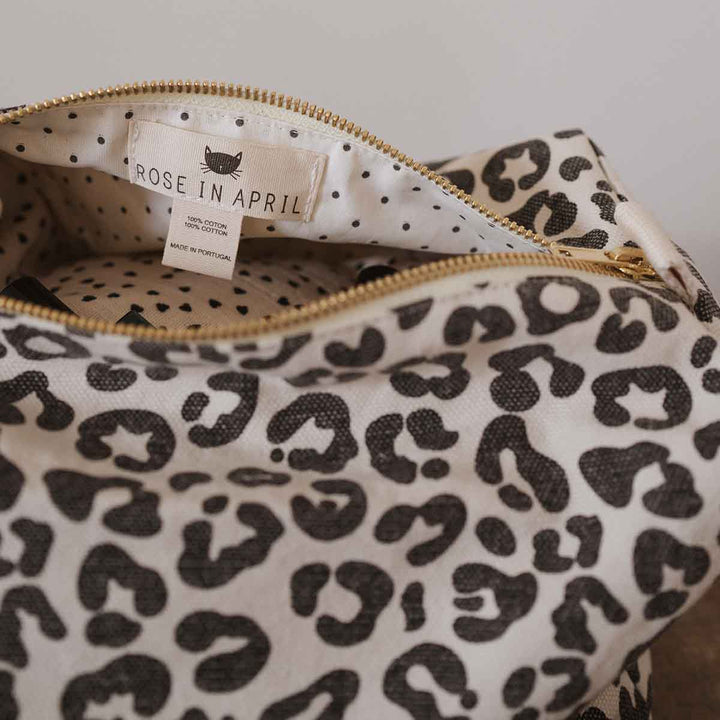 Vic Toiletry Bag in greige leopard print, made from 100% cotton, with a zip closure and label.