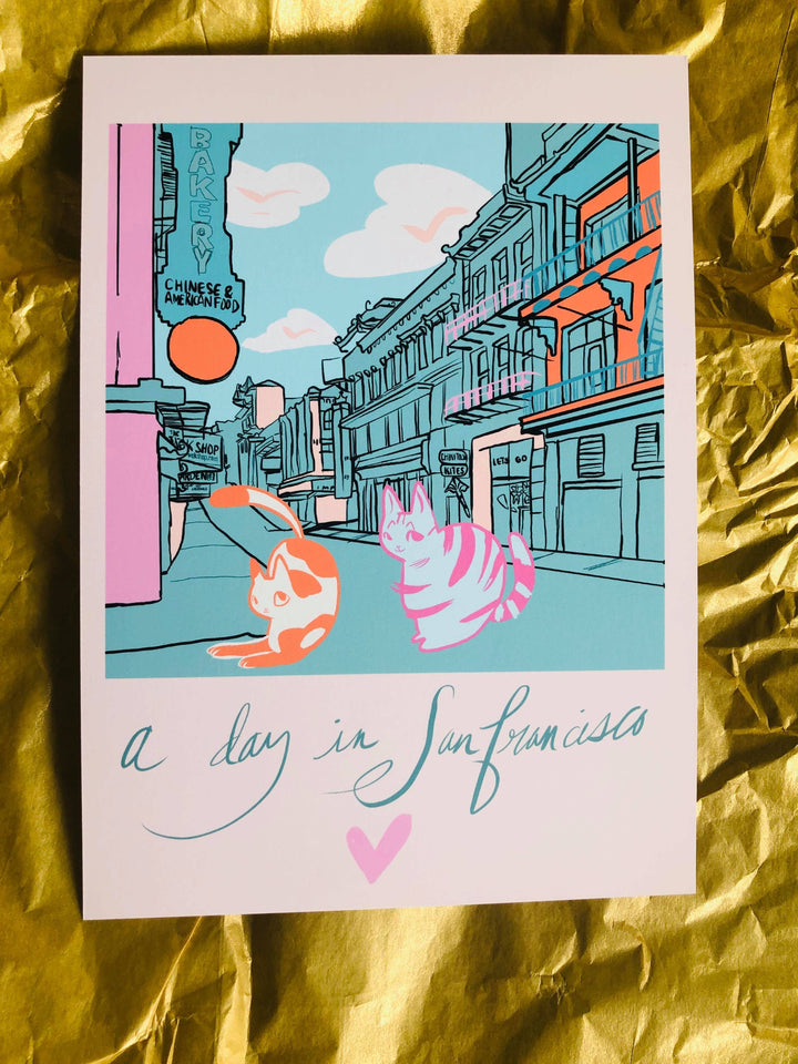 Cat-themed art print titled "A Day in San Francisco" featuring colorful kitties exploring the city. Perfect cat prints for gifts.