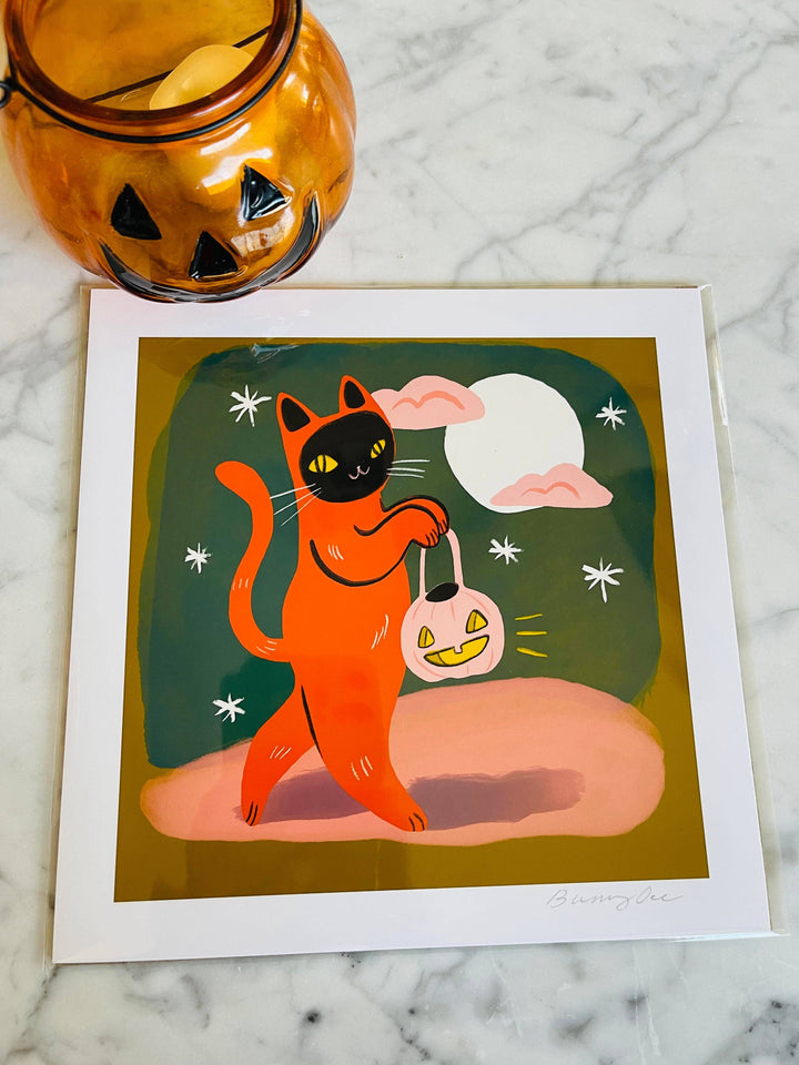 Trick or Treat Orange Cat Print with Halloween art on high-quality matte paper, perfect cat-themed gift and cat art decor for cat lovers.