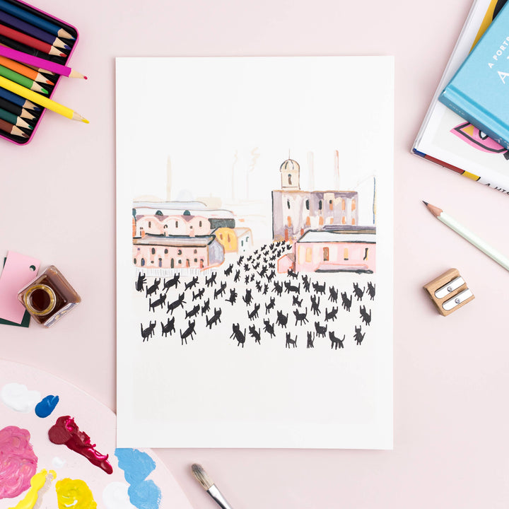Art print featuring a whimsical scene of cats in a vibrant cityscape, inspired by L.S. Lowry's 'At Work'.