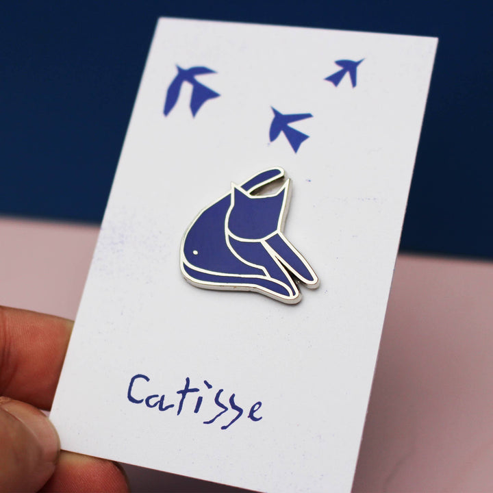 Catisse Blue Cat enamel pin showcasing a stylized cat design inspired by Henri Matisse's art on a decorative card.