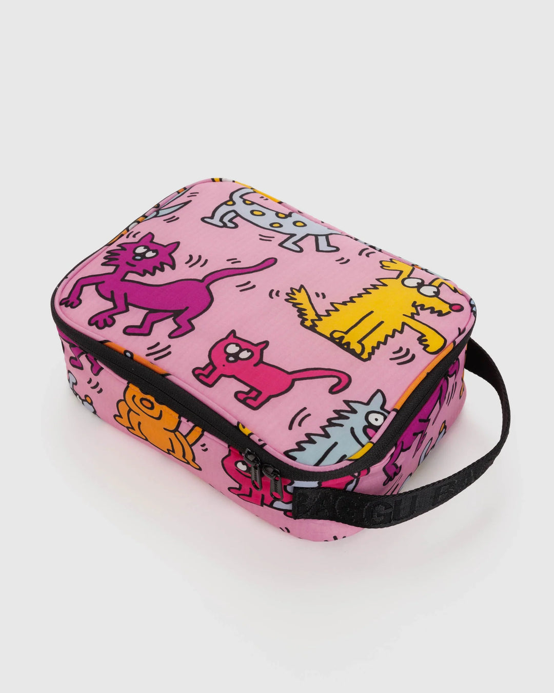 Insulated Keith Haring Pets lunch box with colorful cat and dog prints, zip closure, and black handle, made from recycled materials