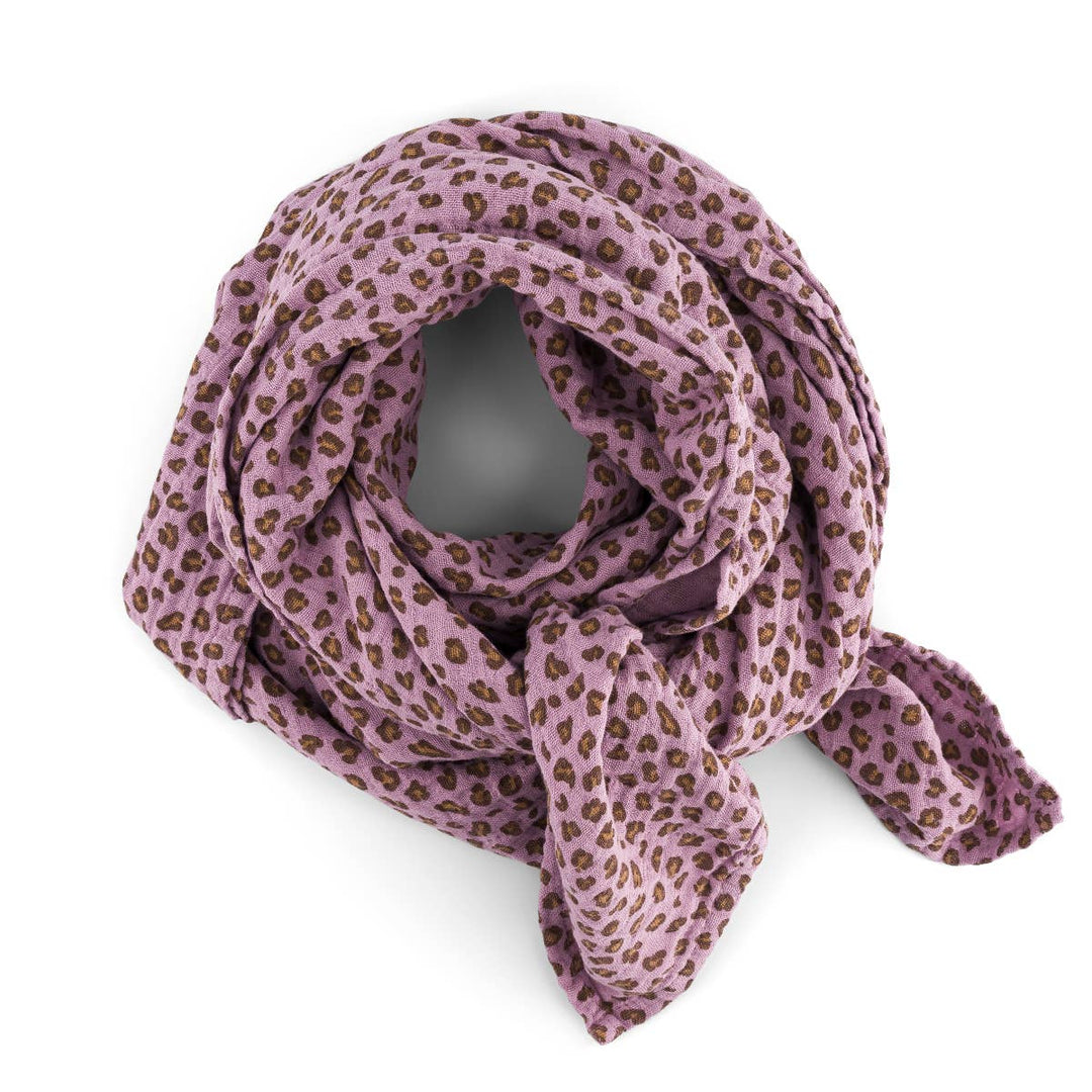 Bianca Swaddle in lilac leopard print, versatile baby blanket, swaddle, and burp cloth, made from 100% cotton muslin.
