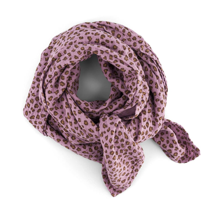 Bianca Swaddle in lilac leopard print, versatile baby blanket, swaddle, and burp cloth, made from 100% cotton muslin.