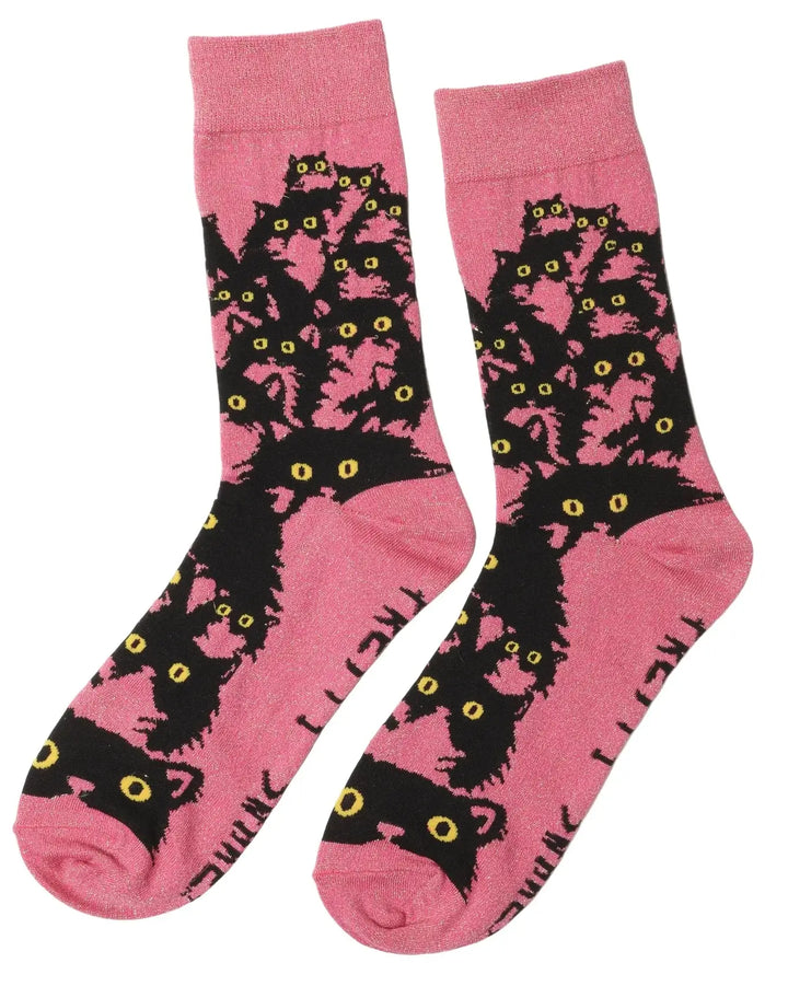 Pink glitter kitty socks featuring playful black cats with bright yellow eyes, perfect for cat lovers.