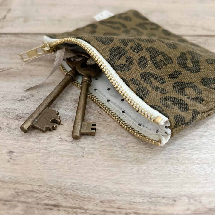 Marie Purse in olive leopard print with keys inside, showcasing its practical design and stylish pattern.