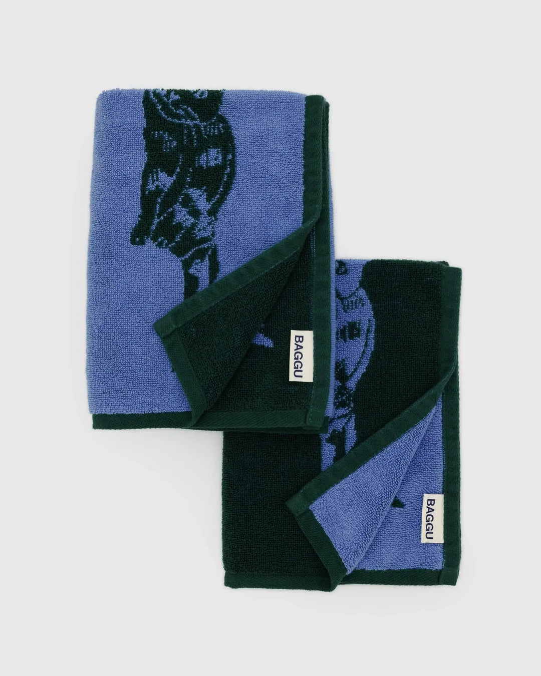 Set of two organic cotton hand towels in blue and dark green with cat design on a white background.