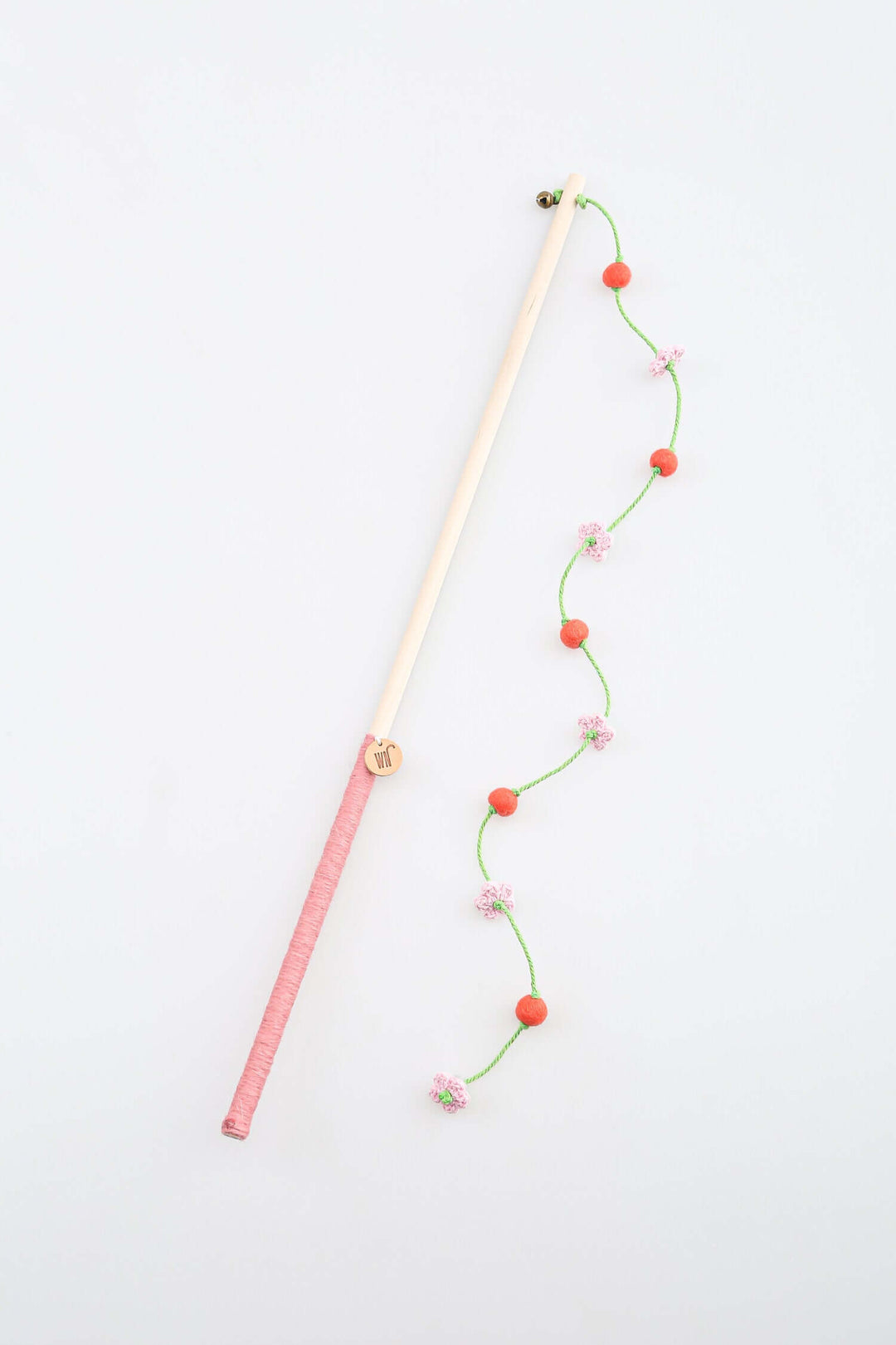Cherry Blossom Wand Toy for cats featuring pink flowers, wool balls, and a birch stick, ideal for luxury playtime.