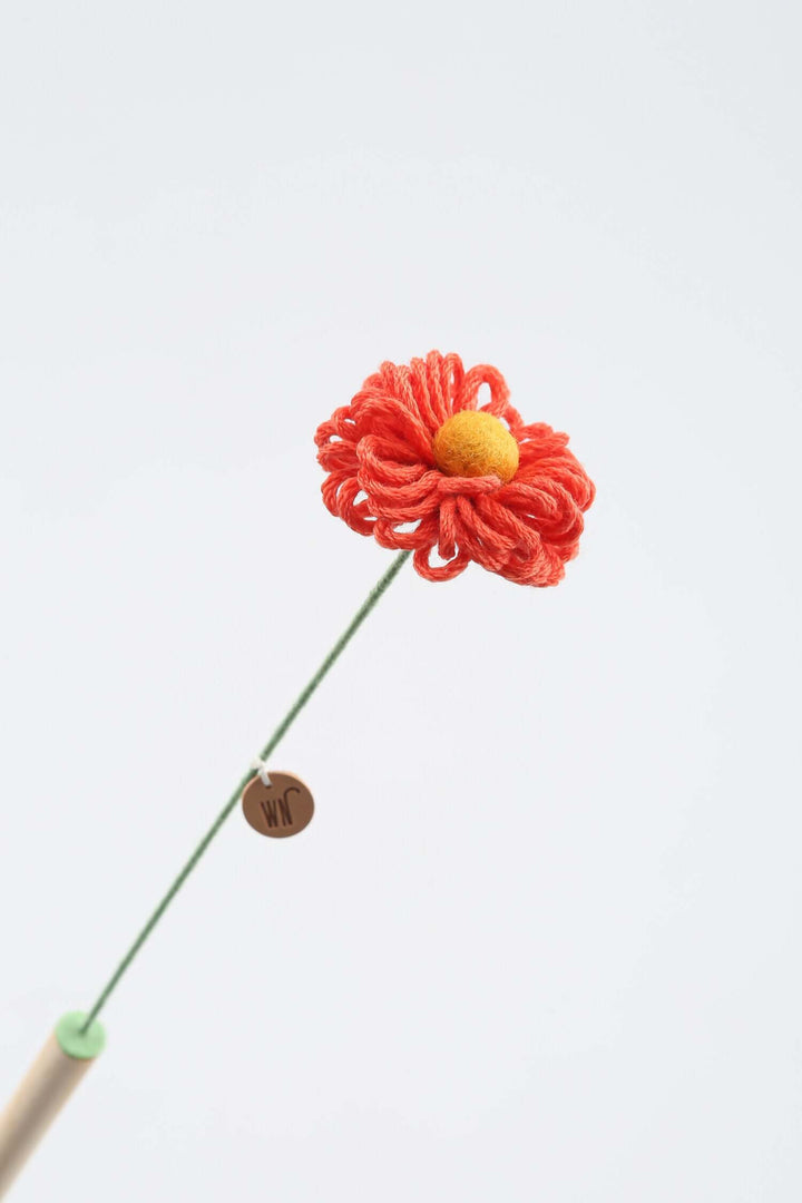 Handmade flower stem cat toy from South Korea, featuring a cute yarn flower and pine stick, designed for playful cats.