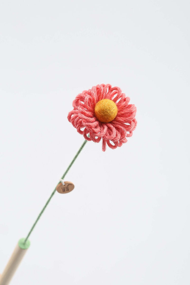 Flower stem cat toy made of wool yarn and a pine stick, ideal catnip toy for playful and cute feline fun.