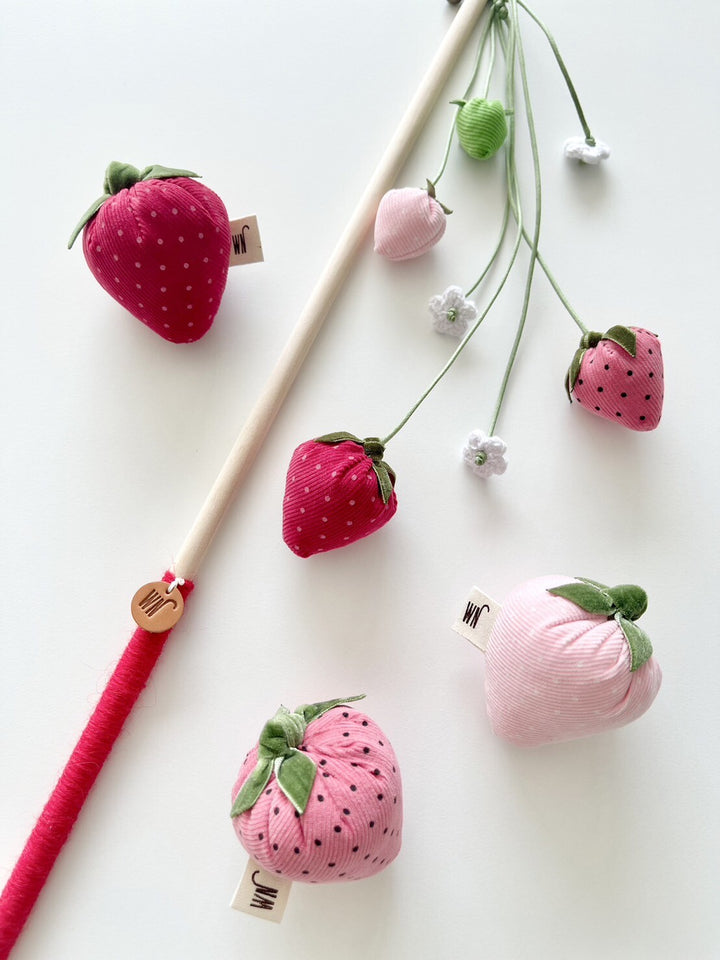 Set of 3 strawberry-shaped catnip toys from South Korea made with corduroy fabric, velvet ribbon, and cotton, including a wand for play