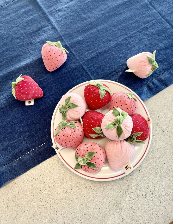 Set of 3 handmade strawberry catnip toys in pink and red, displayed on a white plate, perfect cat toy for summer fun.