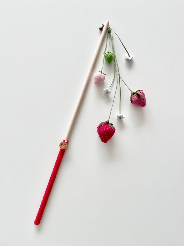 Strawberry Rod Cat Wand Toy featuring strawberries and white flowers, handmade with corduroy, velvet, and birch. Perfect unique cat teaser.