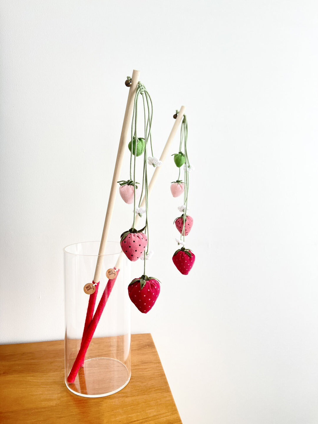 Handmade strawberry rod cat teaser with corduroy, velvet, and birch stick in a glass vase. Unique cat wand toy from South Korea.