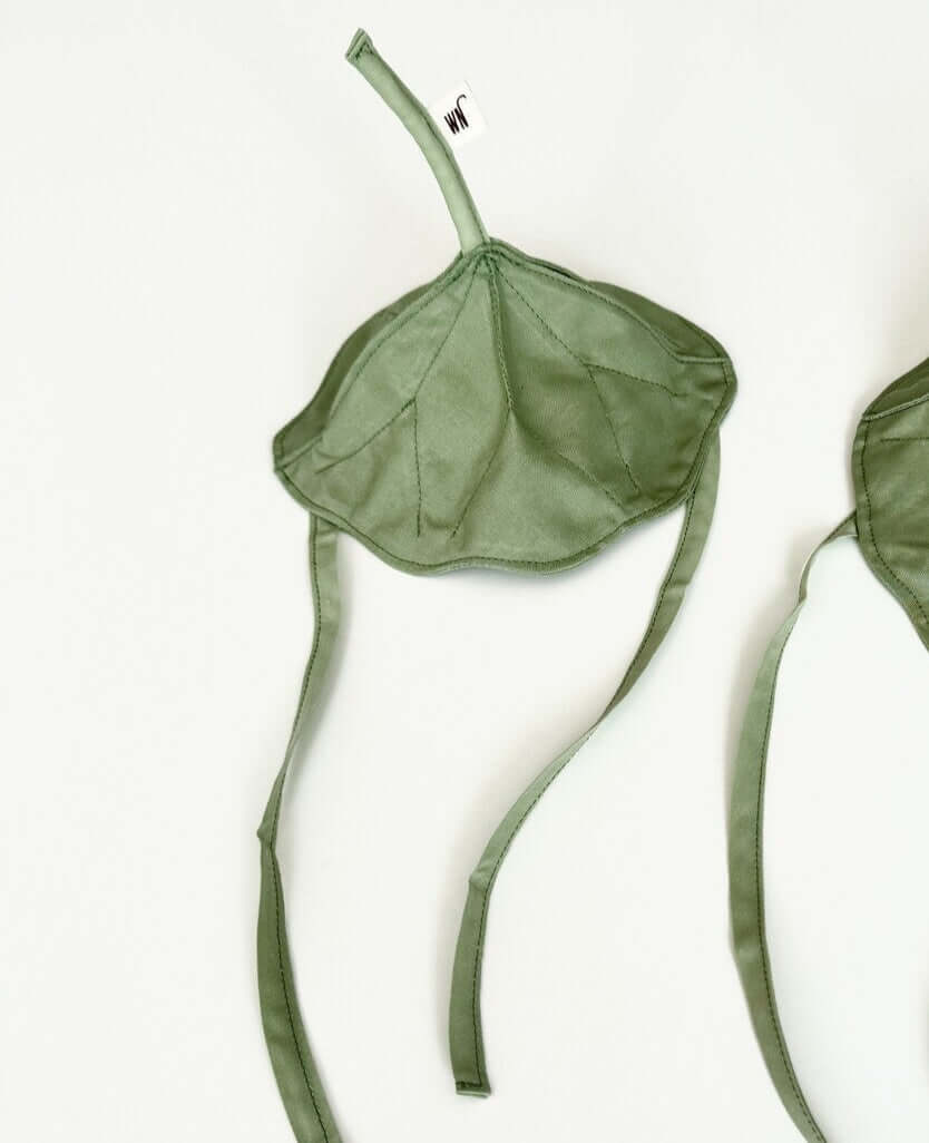 Handmade lotus leaf cat hat in green, perfect for spring picnics and playful catnip fun.
