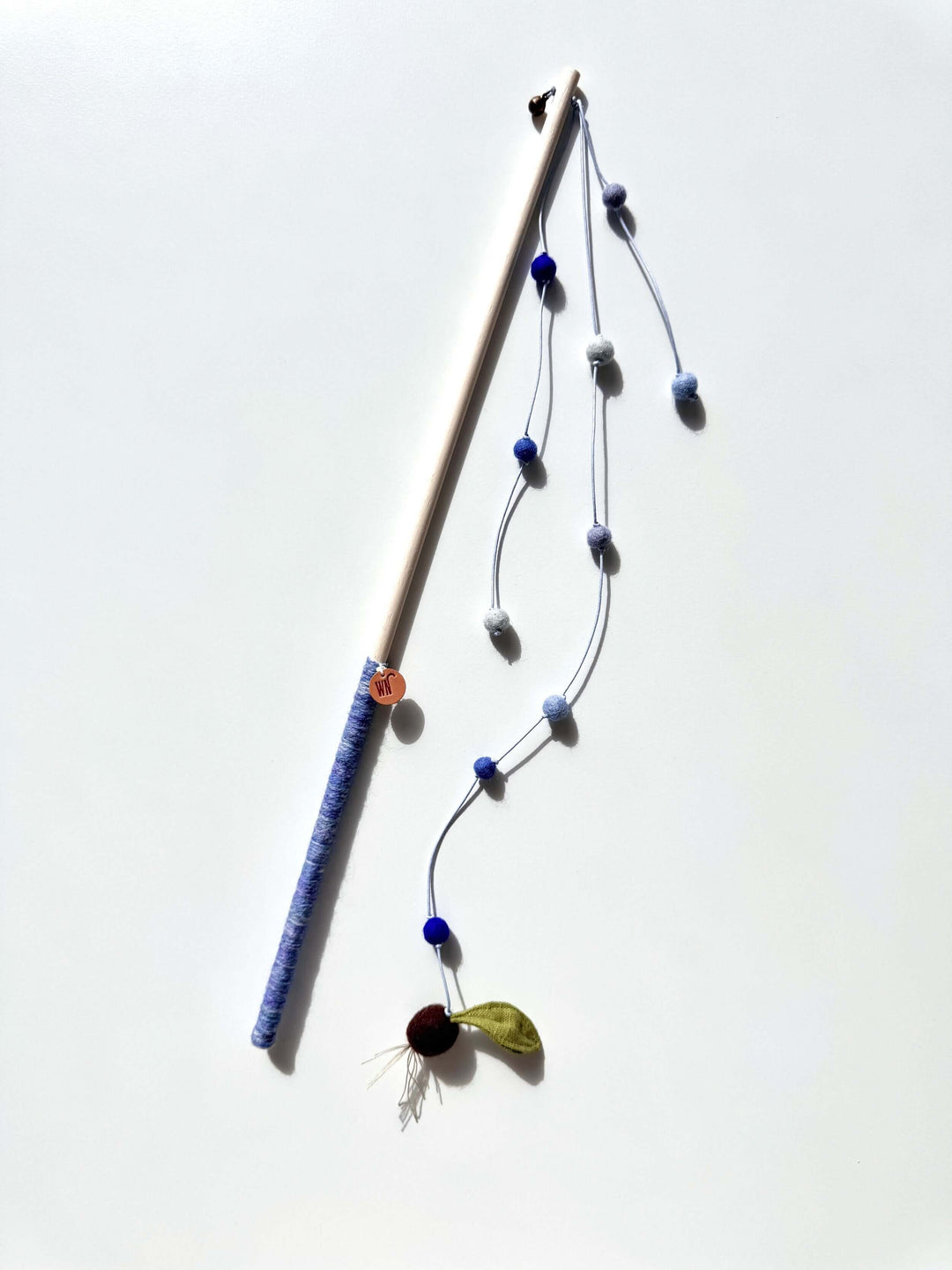 Watering Seeds Wand Toy, a modern cat toy with wool details and colorful beads, perfect for playful cats.