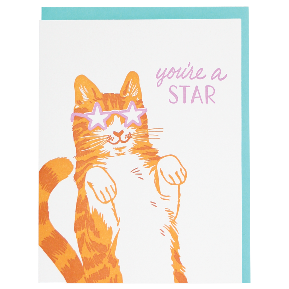 Letterpress printed Star Cat Friendship Card with "You're a star" greeting, featuring an orange cat with star sunglasses on a turquoise envelope.