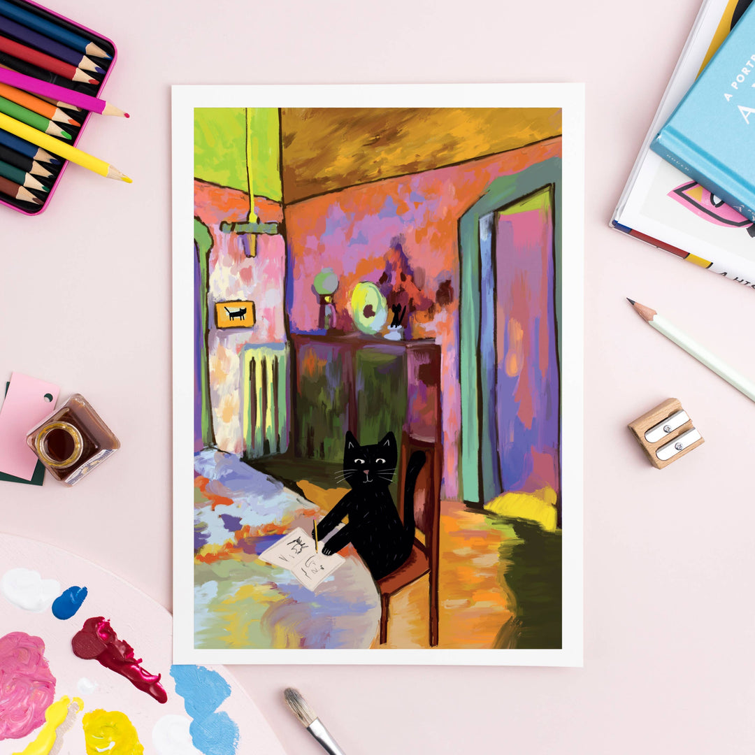 Wassily Catdinsky cat art print inspired by Kandinsky on display with art supplies, perfect cat themed gift for cat lovers.